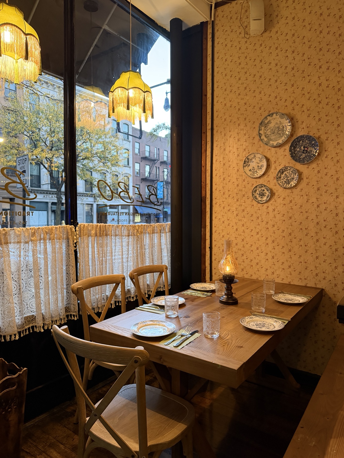 BEBO's inviting table beside a sunlit window